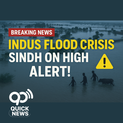 A dramatic aerial view of severe flooding along the Indus River at Guddu Barrage, showing submerged katcha villages and rising waters. Bold headline text reads ‘Indus Flood Crisis – Sindh on High Alert!’ with a warning icon, symbolizing the urgent flood situation in Pakistan.